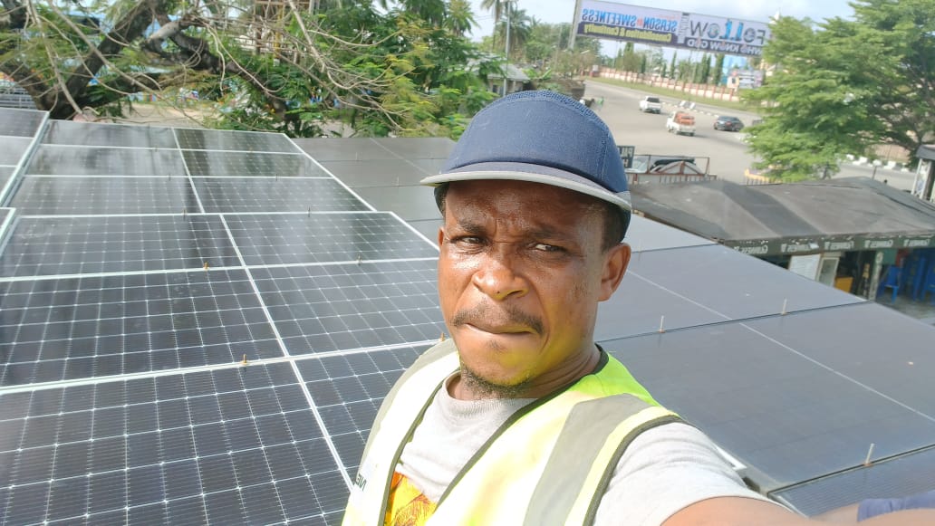POWERSOURCE technician on a commercial rooftop installation
